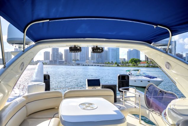 La Dolce Vita 70ft Azimut upper deck seating with table for dining and cocktails