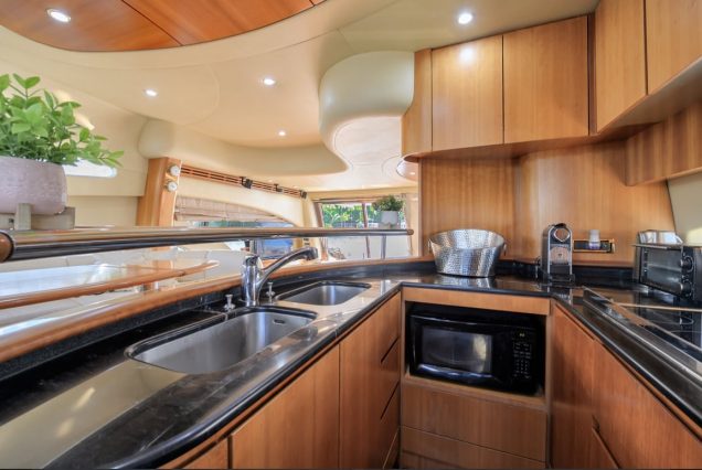 La Dolce Vita 70ft Azimut fully equipped galley with modern finishes