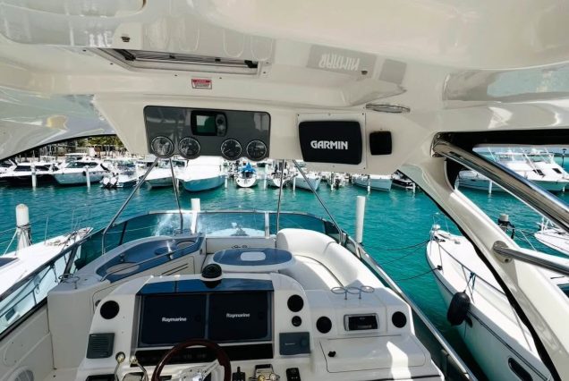 54ft Sea Ray (Sedan Bridge) upper deck seating area with table for drinks and casual dining