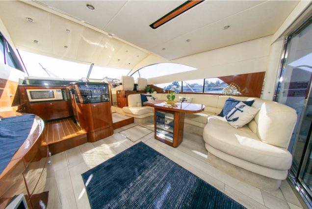 Catalaya 55ft Fairline modern lounge with modern table.