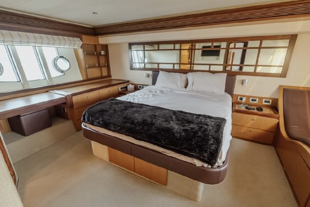 68ft Ferretti Yacht spacious master bedroom designed for relaxation at sea