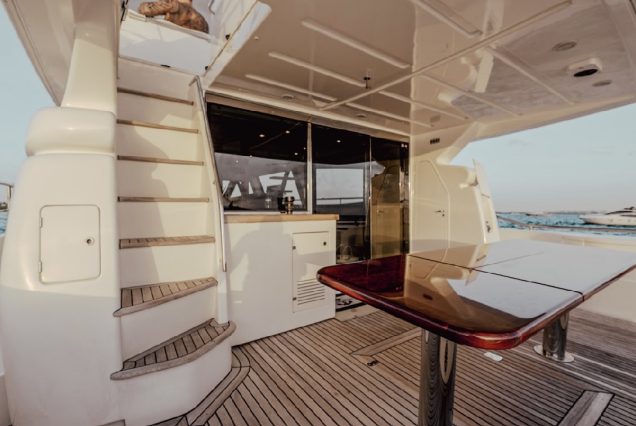 68ft Ferretti Yacht boarding area with steps leading to upper deck.