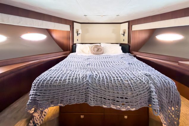 88ft Princess PFO spacious master bedroom offering comfort and privacy at sea
