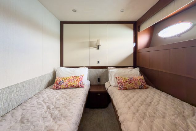 88ft Princess PFO spacious master bedroom offering comfort and privacy at sea