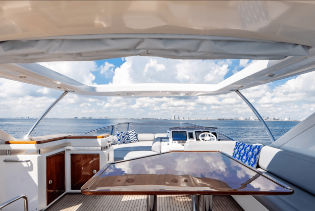70ft Azimut “Days Like This” upper deck seating with table for drinks and casual dining