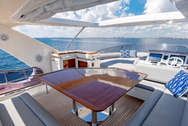 70ft Azimut “Days Like This” upper deck seating with table for drinks and casual dining