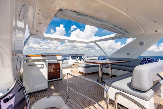 70ft Azimut “Days Like This” upper deck seating with table for drinks and casual dining