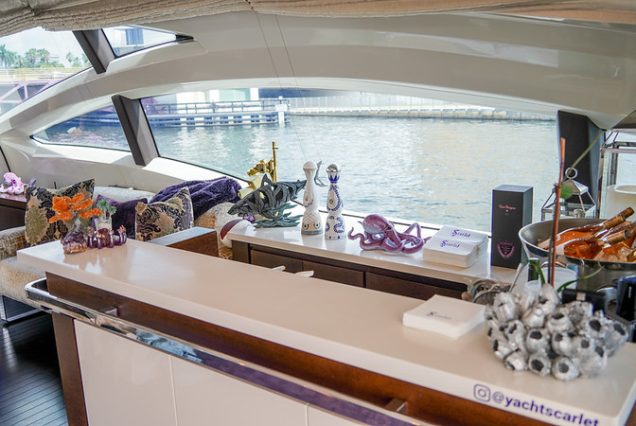 Mega 103ft Azimut SCARLET sophisticated indoor salon with plush seating with perfect mini bar area.