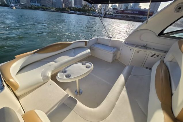 Sun-kissed 45ft Sea Ray Yacht front deck seating with beautiful waterfront views