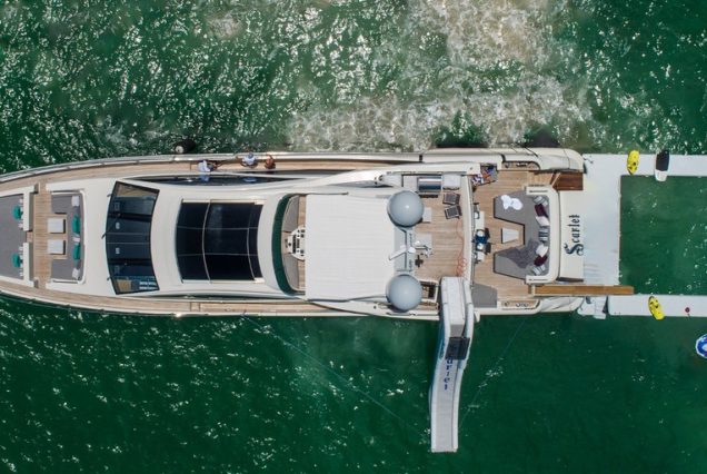 Mega 103ft Azimut SCARLET superyacht available for charter in Miami with inflatable pool and water slide.