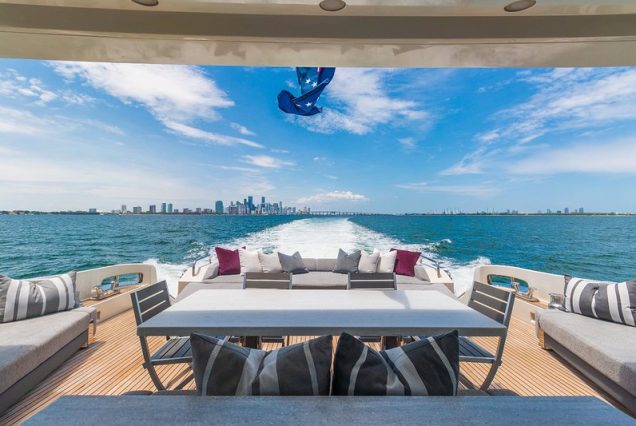 Mega 103ft Azimut SCARLET grand boarding entrance with seating table and access to deck.