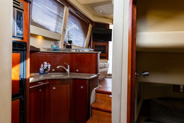 Modern 50ft White Ace Sea Ray Yacht equipped galley connected to salon