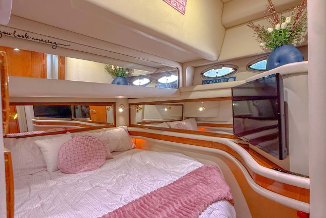 50ft Sea Ray Sedan Coast to Coast Miami guest cabin with stylish interiors and comfortable sleeping space