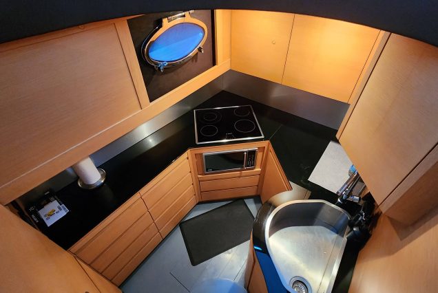Luxury 64ft Pershing Wind Miami fully equipped galley with sleek contemporary finishes