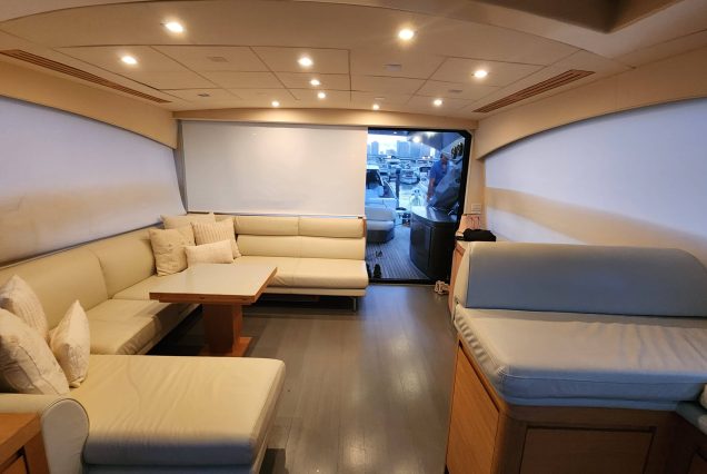 Luxury 64ft Pershing Wind Miami sophisticated indoor salon with modern seating and elegant décor