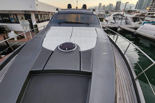 Luxury 64ft Pershing Wind Miami bow lounge area with stunning waterfront and skyline views