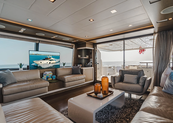 Top Shelf 87ft Ferretti Miami stylish lounge with table for social gatherings and entertainment