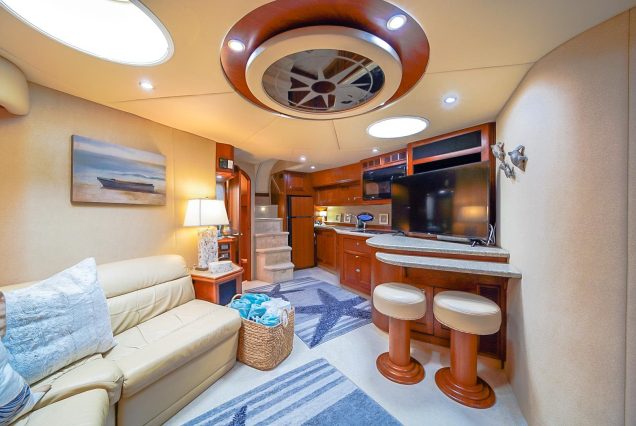 Good To Be Me 60ft Cruiser Miami sophisticated indoor salon with plush seating and elegant décor