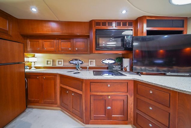 Good To Be Me 60ft Cruiser Miami fully equipped galley with sleek modern finishes