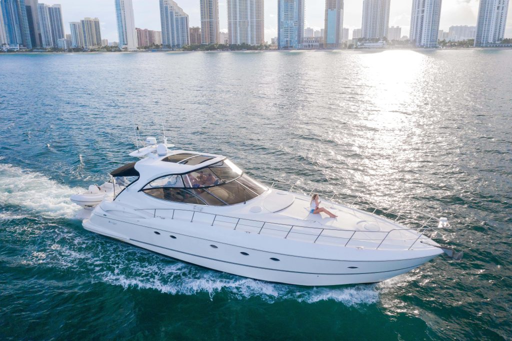 Good To Be Me 60ft Cruiser Miami bow lounge area with breathtaking waterfront and skyline views