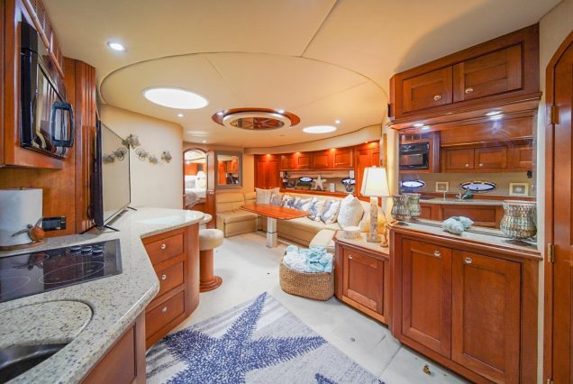 Good To Be Me 60ft Cruiser Miami sophisticated indoor salon with plush seating and elegant décor