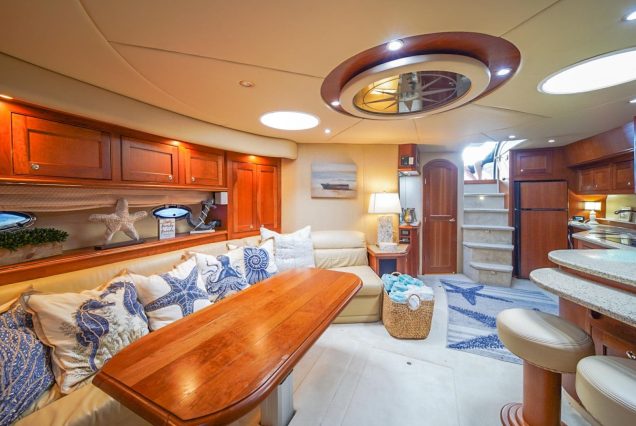 Good To Be Me 60ft Cruiser Miami sophisticated indoor salon with plush seating and elegant décor