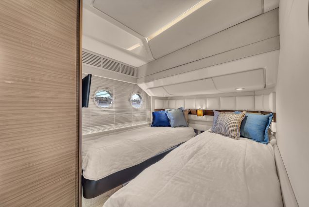 65ft NEPTUNES Yacht Miami guest cabin with elegant interiors and comfortable sleeping space
