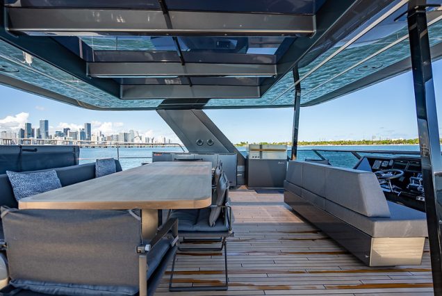 Sunreef 70ft ARCHIPIELAGO Miami grand boarding access leading to spacious entertainment areas with comfortable seating area and modern table.