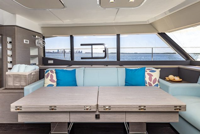 50ft Fountaine Happy Place Miami contemporary lounge with table for entertainment