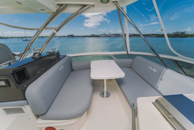 52ft Sea Ray Bridge Miami upper deck seating with table for cocktails and casual dining