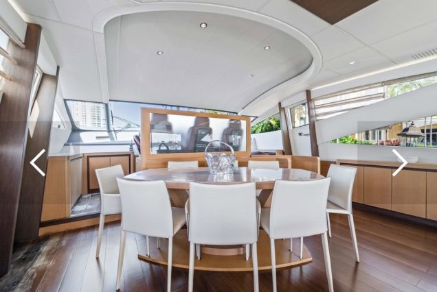Shadow 94ft Pershing Miami stylish lounge with table for entertainment and gatherings