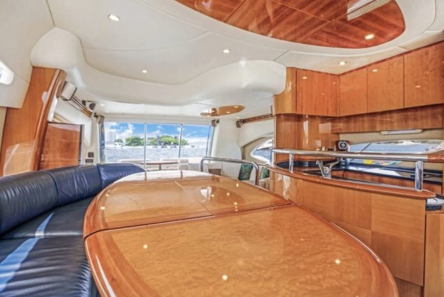 AZIMUT Victoria 70ft Pink Miami stylish lounge with table for entertainment and social gatherings