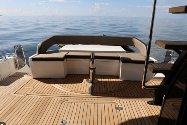 Modern 53FT Galeon Miami boarding area with easy access to all yacht spaces with seating area.