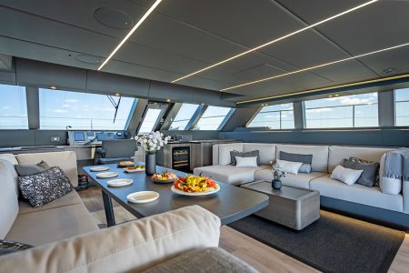 Sunreef 70ft ARCHIPIELAGO Miami luxury lounge with table for refined social gatherings