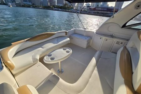 Sun-kissed 45ft Sea Ray Yacht front deck seating with beautiful waterfront views