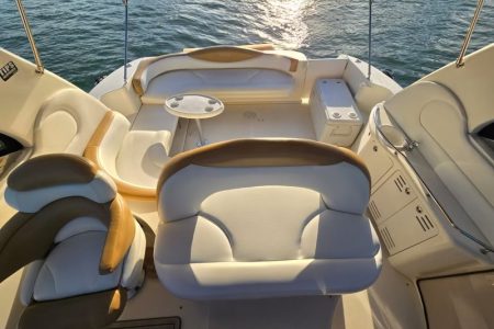 Sun-kissed 45ft Sea Ray Yacht front deck seating with beautiful waterfront views