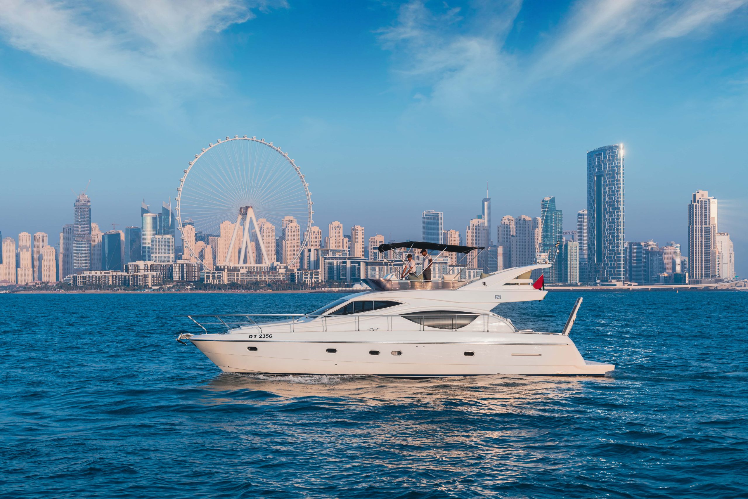 Luxurious 50FT Aliona Yacht sailing in Dubai water with Ain Dubai view